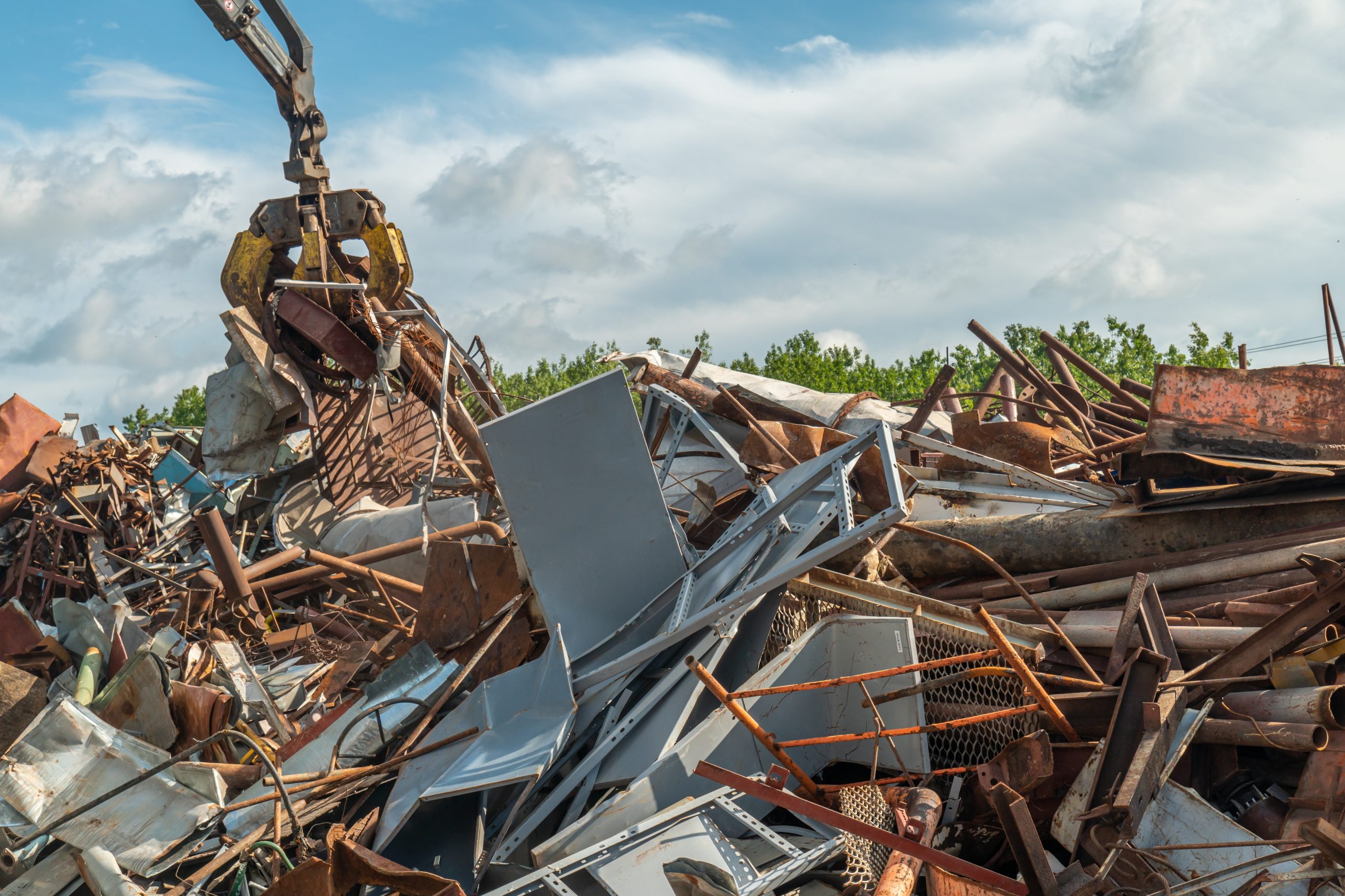 Crane picking up scrap metal